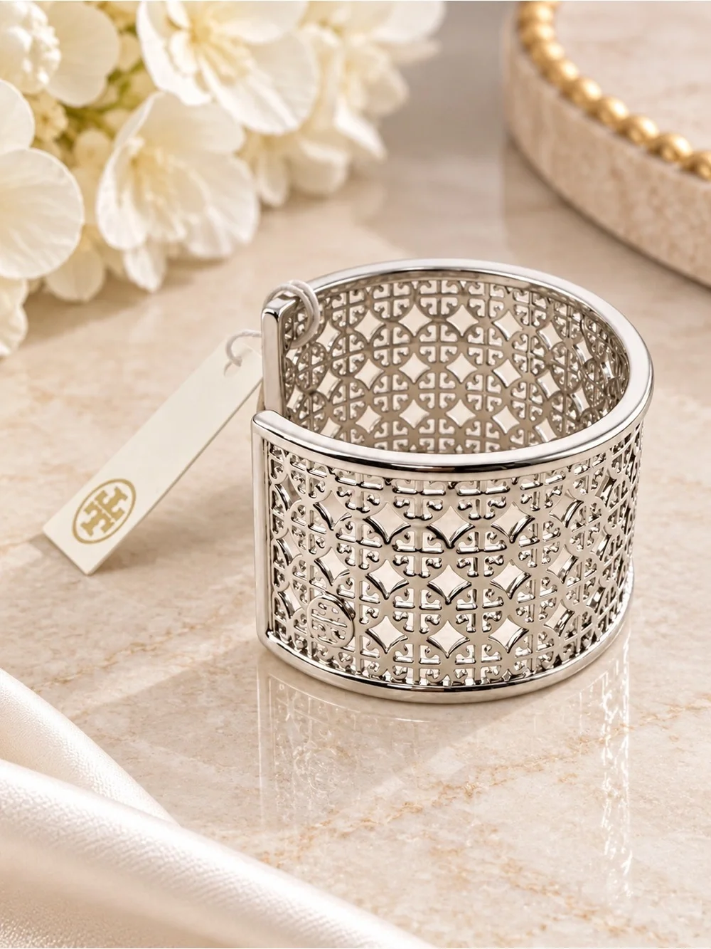 Tory Burch Miller logo cuff bracelet in silver.